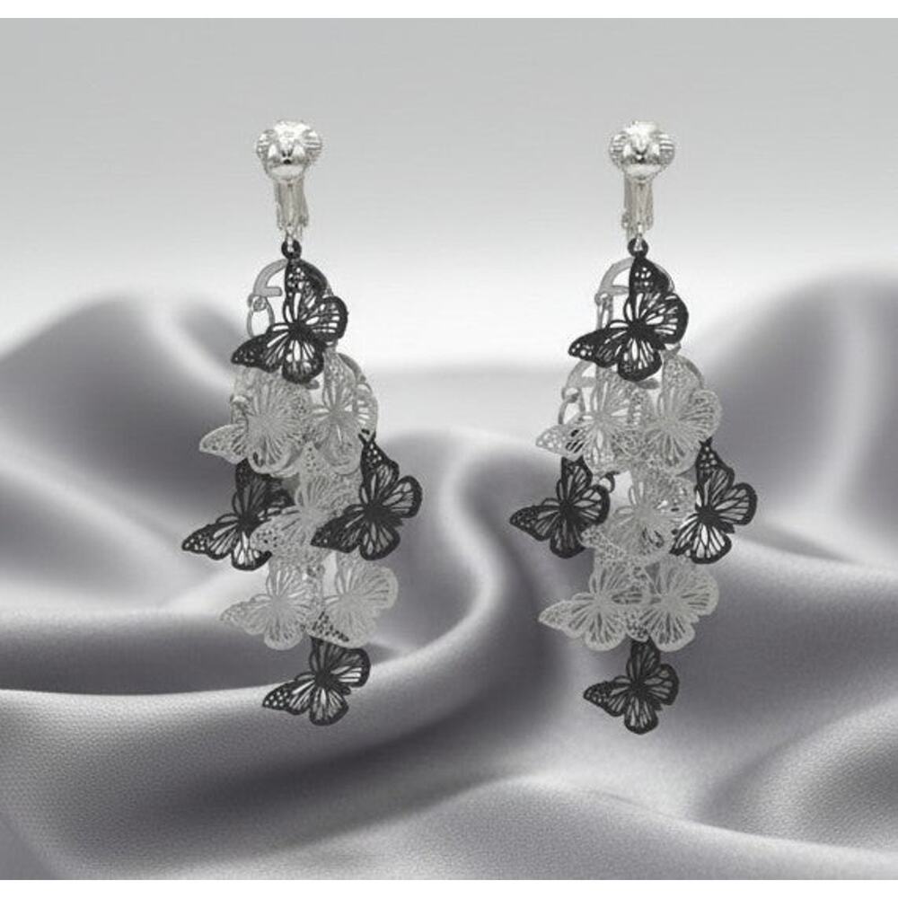 Clip on 2 3/4" silver, white and black butterfly layered dangle earrings